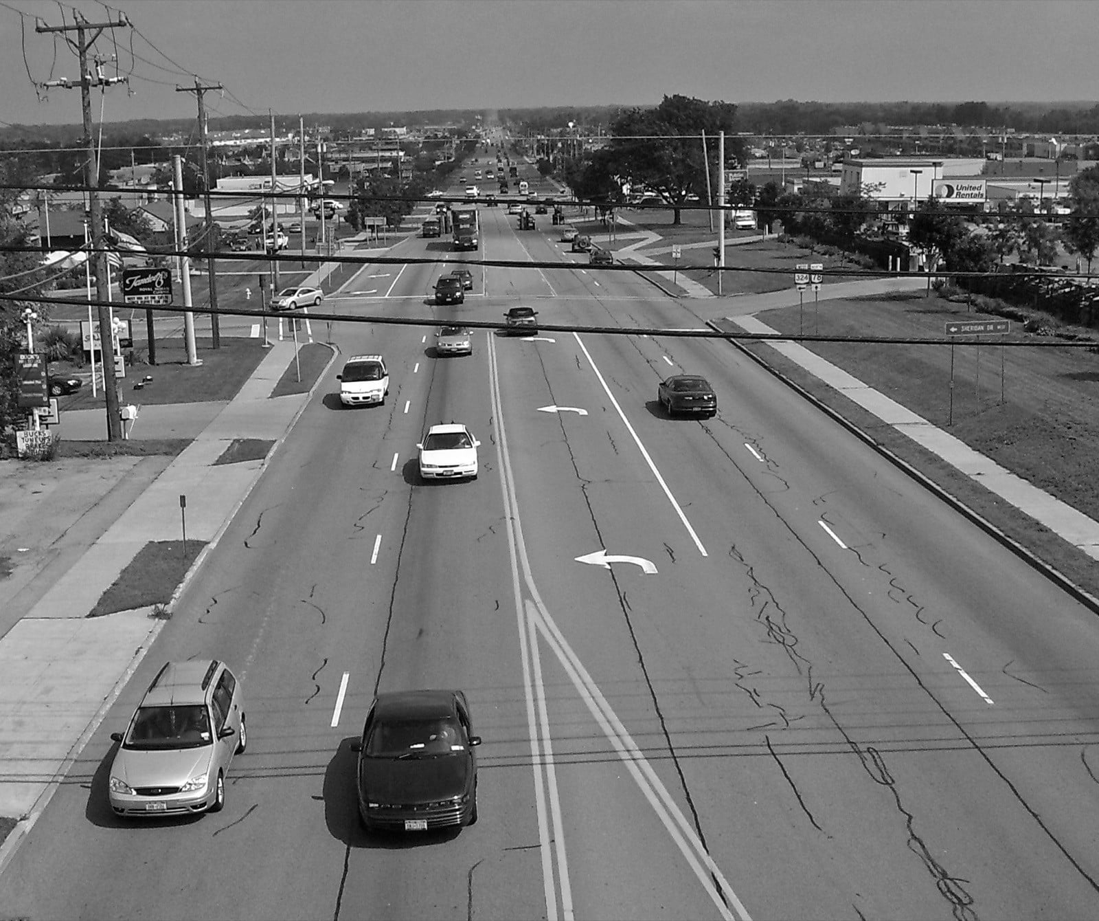 Seven-lane suburban arterial with a center turn lane and strip development on both sides